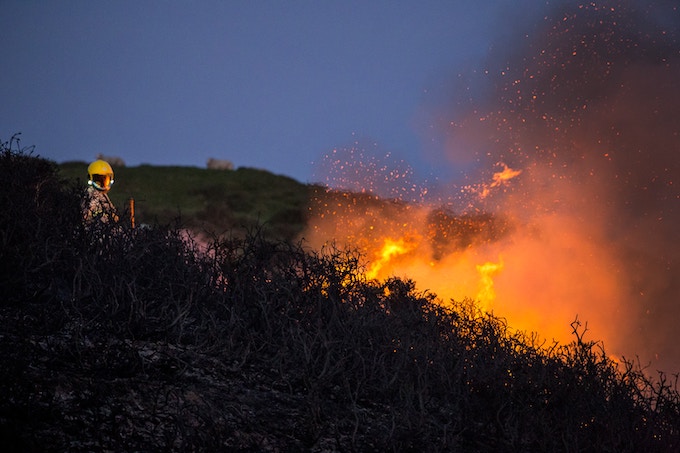 firefighter fighting blaze